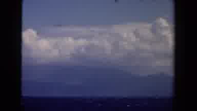 Netherlands (1946): Ocean And Cloud Covered Mountains Viewed In Distance From Boat