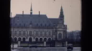 Netherlands (1946): View Of Car Driving Past Castle Building On Cloudy Day