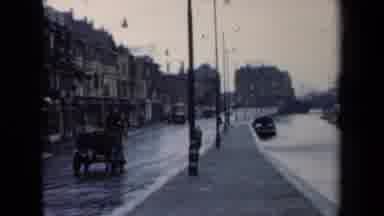 Netherlands (1946): Quiet Street In A European City With A Horse Drawn Carriage