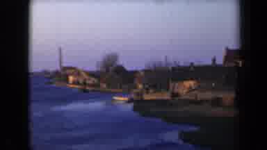 Netherlands (1946): Coastline With Small Brown Houses Building With Leiden Sign On