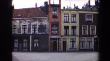 Netherlands (1946): A Town With Connected Buildings With An Old Street And Lamp