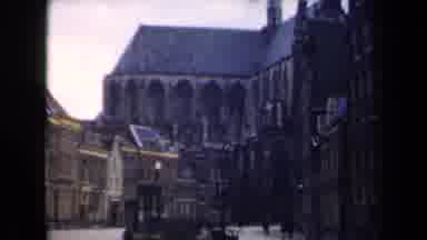Netherlands (1946): Large Buildings Along Quiet Street People Walking Yellow