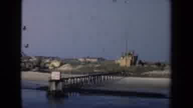 Netherlands (1946): A Harbor Remains Calm On A Clear Day With Its Name Board