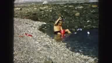 Kansas City Missouri (1959): Kids Playing In The Water On A Rocky Beach With Pails