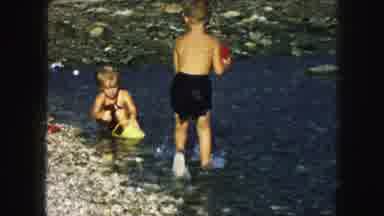 Kansas City Missouri (1959): Children At The Water's Edge Playing And Having Fun