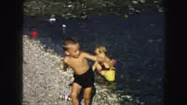 Kansas City Missouri (1959): A Young Boy And Girl Dressed In Swimming Attire Play