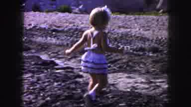 Kansas City Missouri (1959): Blonde Headed Child Running Around And Playing In Mud