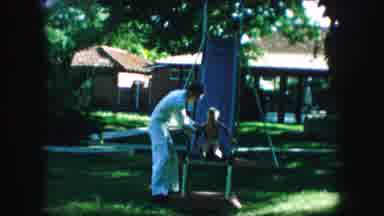Kansas City Missouri (1959): Child Being Caught Going On Slide