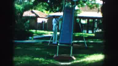 Kansas City Missouri (1959): Little Girl And Parent Having Fun At A Homemade Slide