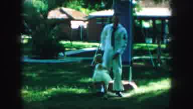 Kansas City Missouri (1959): A Navy Veteran In His Uniform Helping His Son And