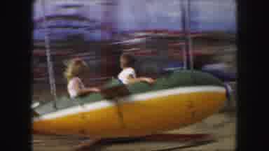 Kansas City Missouri (1959): Male And Female Riding Airplane Ride At County Fair