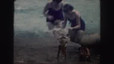Kansas City Missouri (1959): Family Playing In The Ocean Splashing In The Water