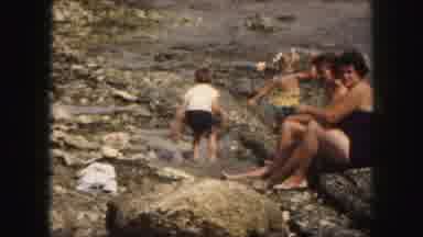Kansas City Missouri (1959): Mother Watches Her Two Children Jump And Splash In