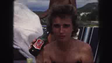 Kansas City Missouri (1959): Woman In Swimsuit Drinking A Beer While Seated On A
