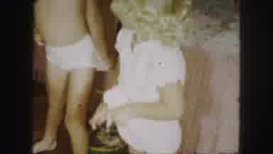 Kansas City Missouri (1959): Mommy Having Difficulty With Toddler Getting Dressed