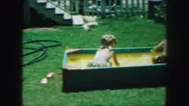 Kansas City Missouri (1959): Girl Boy Playing Swimming Garden Water Sun Smiling