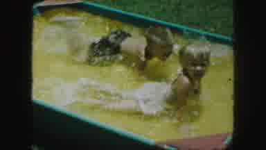 Kansas City Missouri (1959): Two Children Playing In A Small Wading Pool With A