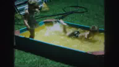 Kansas City Missouri (1959): Summertime Two Children Girl Boy Fun Splashing