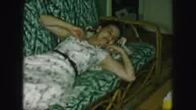 Kansas City Missouri (1959): A Woman Lays Down Talking To A Woman Sitting In A