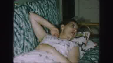 Kansas City Missouri (1959): Lady In Dress Relaxing On Sofa With Feet Propped Up