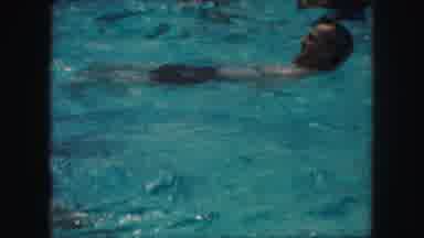 Kansas City Missouri (1959): A Public Pool With People Swimming In It And Having