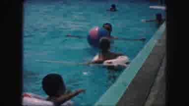 Kansas City Missouri (1959): Children With Life Preservers Play In Pool Where