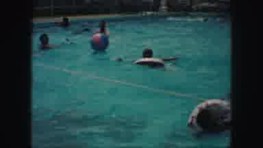 Kansas City Missouri (1959): People Are Playing In The Water Of The Pond With A