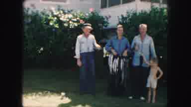 Kansas City Missouri (1959): Family Poses For Photograph In Front Of Rose Bushes