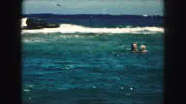 Kansas City Missouri (1959): People Swimming In The Ocean On A Beautiful Sunny Day