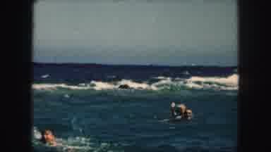 Kansas City Missouri (1959): A Group Of People Swimming In The Ocean Near Big