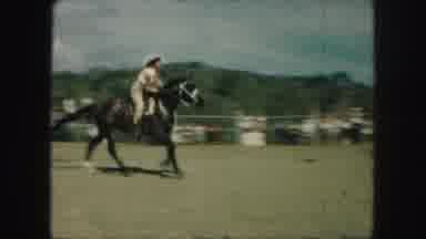 Kansas City Missouri (1959): Crowd Watches In Awe As Rodeo Horse Rider Rides