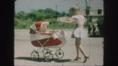 Kansas City Missouri (1959): Girl Walking With Baby Carriage Scratches Her Own