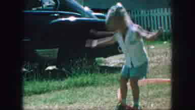 Kansas City Missouri (1959): Children Play With A Hula Hoop And Appear To Be