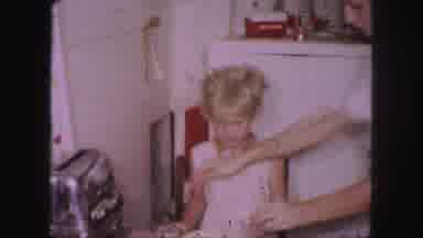 Kansas City Missouri (1959): Woman Placing Something In A Bowl Of Food That She Is