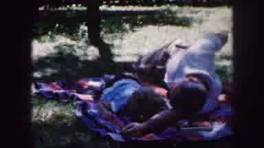Kansas City Missouri (1959): Young Girl Laying With Father On Blanket Outdoors In