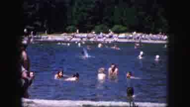 Kansas City Missouri-1959: Large Group Of Families Play In The Lake While A Tortoise Moves On Sand