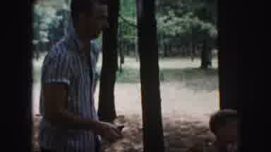 Kansas City Missouri (1959): People Are Having Food And Drink While Sitting Under