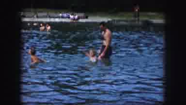 Kansas City Missouri-1959: Mother And Father Playing In Water With Their Two Children
