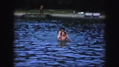 Kansas City Missouri (1959): Woman And Two Small Children Swimming Together On A