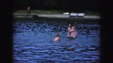 Kansas City Missouri (1959): Children Playing With Their Mother In A Shallow Body