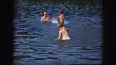 KANSAS CITY MISSOURI-1959: Children Play In Lake And Eat Snacks At Park