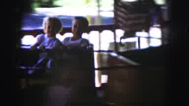 Kansas City Missouri (1959): Two Small Children Sharing A Ride On A Spinning