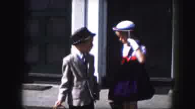 Kansas City Missouri (1959): Young Boy And Girl Dressed Up Go Down The Steps And