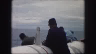Kansas City Missouri (1959): Several Men In A Large Ship Out On The Open Water Use