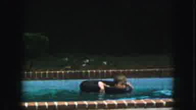 Kansas City Missouri (1959): Child Floating In Inner Tube In Outdoor Pool; Woman