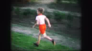 Kansas City Missouri (1959): Boy Runs To Join Girl And They Feed Ducks In The
