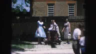 Kansas City Missouri (1959): View Of Green Garden With People Walking Past Milk