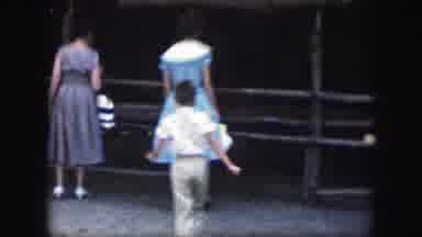 Kansas City Missouri (1959): Little Girl In Dress Jumps From A Low Wall Into A
