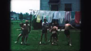 Kansas City Missouri (1959): Kids Running Around A Man And Playing Tag