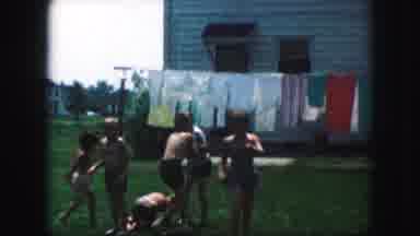 Kansas City Missouri (1959): Kids Playing Yb A Clothesline In Bathing Suits